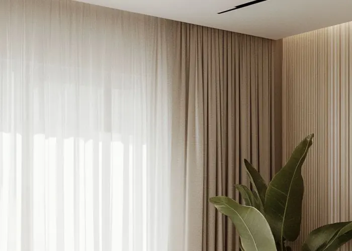 Cortinas con pestaña americana en riel hotelero en Gamarra